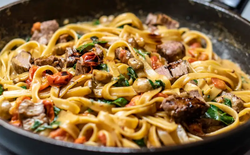 Pasta salad with tuna, vegetables, and herbs