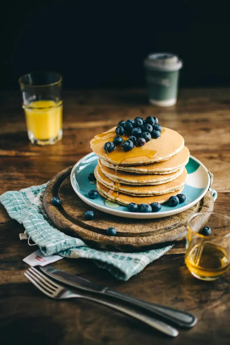 Toast topped with beans, herbs, and tomatoes